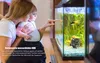 A woman and child looking at a fish tank with an action camera inside. Produktbild-Vorschau