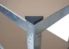 Close-up of the corner of a metal shelf with a brown particle board shelf surface and a black corner protector. Náhled obrázku produktu