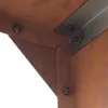 A close-up view of metal corner brackets and bolts on a weathered, rusty metal structure. Produktbild-Vorschau