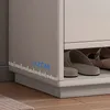Close up view of a shoe rack with shoes inside, showing a measurement guide. Náhled obrázku produktu