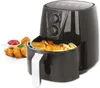 A black air fryer with a basket full of food, next to a plate of chicken nuggets and ketchup. Produktbild-Vorschau