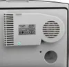 The back of a white portable cooler with a label and a fan vent. Podgląd zdjęcia produktu