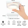 A hand is holding a white square recessed spotlight, with dimensions and technical specifications shown in diagrams and icons. Náhled obrázku produktu