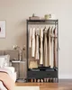 A bedroom scene with a clothing rack. Náhled obrázku produktu