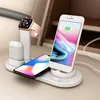 A white charging station with an iPhone, an Apple Watch, and AirPods charging. Produktbild-Vorschau