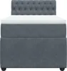 A front view of a dark gray box spring bed with a white mattress topper and a tufted headboard, set against a white background. Produktbild-Vorschau