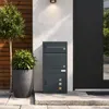SoBuy Paketbox OGS66-DG neben Pflanze an Hauswand mit Holzverkleidung Productafbeelding-voorbeeld