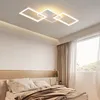 A modern bedroom with a bed and a ceiling light. Produktbild-Vorschau