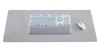 A keyboard and mouse are placed on a large gray mousepad. Anteprima dell’immagine prodotto