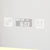 A digital display on a mirror showing the date, time, and temperature, along with icons for features like heating, timer, and CCT lighting. Náhled obrázku produktu