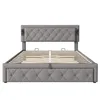 A front view of a gray upholstered bed frame with a tufted headboard and a slatted mattress support system. Produktbild-Vorschau