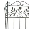 Close-up view of the top of an ornate metal shelf. Produktbild-Vorschau