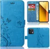 A collage of images showing a blue flip phone case with a floral and butterfly design, including views of the case open with cards and a phone, and closed.
