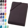 A folded dark brown fitted sheet is shown on a white background, with a collage of other colored fitted sheets arranged to the left. Produktbild-Vorschau