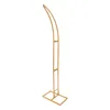 A gold metal stand with a curved top and a rectangular base, isolated on a white background. Podgląd zdjęcia produktu