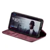 A smartphone in a burgundy flip case is displayed on a white background, showing a movie poster on its screen. Produktbild-Vorschau