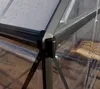 Close-up view of the corner joint of a greenhouse structure, showing the aluminum frame and clear polycarbonate panels. Produktbild-Vorschau