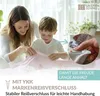 A mother and child are shown folding a pink duvet cover with a floral pattern. A close-up inset highlights a YKK zipper. Produktbild-Vorschau