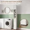 A tall, narrow white cabinet is shown in a laundry room setting next to a washing machine. The cabinet is filled with various toiletries and personal care items. Produktbild-Vorschau