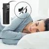 A woman is sleeping peacefully in bed, with a small aquarium filter placed near her head. A "mute" symbol is overlaid on the image. Podgląd zdjęcia produktu