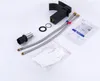 A black waterfall-style bathroom faucet and its accessories are laid out on a white background. Produktbild-Vorschau