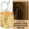 A product shot of a string of LED lights coiled on a white surface, next to its packaging. Produktbild-Vorschau