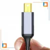 A hand holding a Mini DisplayPort to HDMI cable connector. Podgląd zdjęcia produktu