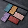 A collection of six wallet phone cases with a geometric pattern, arranged diagonally on a dark textured surface. Anteprima dell’immagine prodotto