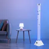 A living room scene with a sofa, a side table with a lamp, and a tall bubble lamp with decorative fish. Produktbild-Vorschau