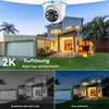 A modern house with a garage and lawn, featuring a security camera and showcasing day and night vision capabilities. Produktbild-Vorschau