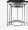 A set of three nesting tables with black marble tops and silver legs against a white background. Anteprima dell’immagine prodotto