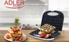 A waffle maker is open, with waffles inside and on a plate next to it, decorated with strawberries and blueberries. The Adler Europe logo is visible at the top. Anteprima dell’immagine prodotto
