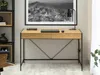 A modern desk setup with a laptop, lamp, and artwork. Náhled obrázku produktu