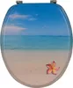 A toilet seat with a tropical beach scene printed on it. Produktbild-Vorschau