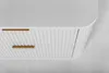 A close-up view of a white cabinet with gold handles. Produktbild-Vorschau