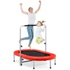 A mother and child are jumping on a red oval trampoline with a safety bar. Anteprima dell’immagine prodotto