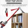 A vacuum cleaner attachment is shown cleaning a high shelf. Produktbild-Vorschau