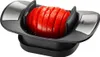 A tomato slicer with a sliced tomato inside, shown from a slightly elevated angle. Produktbild-Vorschau