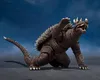 A brown monster figure with spikes on its back and tail is posed on a dark surface against a dark blue sky background. Náhled obrázku produktu