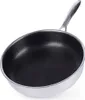 A close-up, angled view of a single stainless steel frying pan with a honeycomb pattern on its interior surface, set against a white background. Produktbild-Vorschau