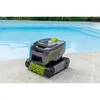 A robotic pool cleaner sits on the edge of a swimming pool. Produktbild-Vorschau