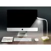 A desk setup with a computer, keyboard, mouse, tablet, and a desk lamp. Produktbild-Vorschau