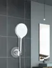 A shower head holder is mounted on a tiled wall in a modern bathroom. Anteprima dell’immagine prodotto