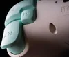 A close-up shot of a gaming controller, focusing on the buttons and textured casing. Produktbild-Vorschau