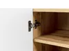 A close-up view of a cabinet hinge connecting a white door to a wooden interior shelf. Náhled obrázku produktu