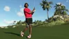 A person playing golf on a sunny day with palm trees in the background. Produktbild-Vorschau