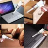 Weißer Mini-Handstaubsauger, verwendet in vier verschiedenen Szenarien: Reinigung einer Laptop-Tastatur, einer Schublade, eines Bettes und eines Kofferraums Náhľad obrázku produktu