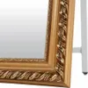 A close-up view of the ornate golden frame of a mirror. Náhľad obrázku produktu