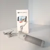 A DJI Osmo Mobile 7 smartphone gimbal and its packaging are displayed on a white surface. Voir les images du produit