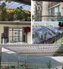 A collage of images showing different aspects of a transparent tarp, including its use on a balcony, with plants, and a view of a landscape. Voir les images du produit